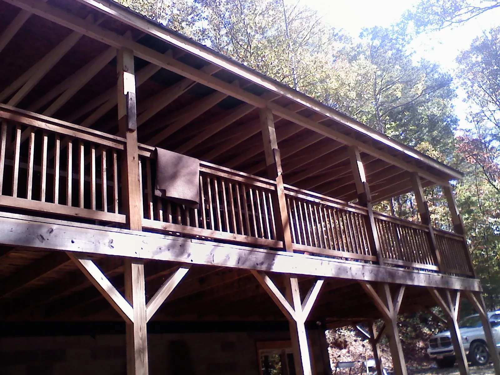 Timber framing under a new elevated porch and deck — Roof Leak Repair in Mossville by Roofing Brothers